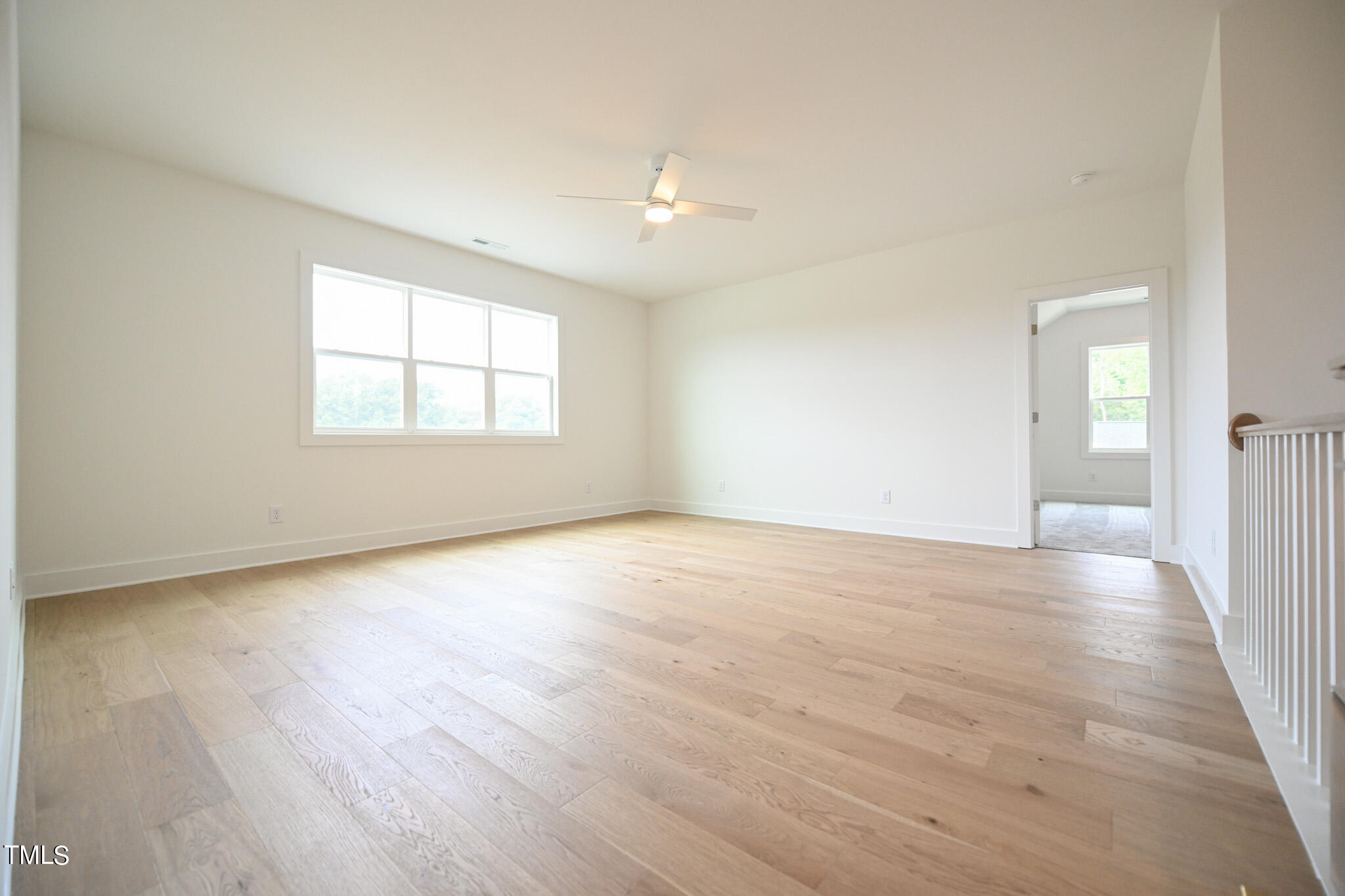 143 Sallyport Court Raleigh, NC 27603 - Photo 31 of 46 an empty room with wooden floor and windows