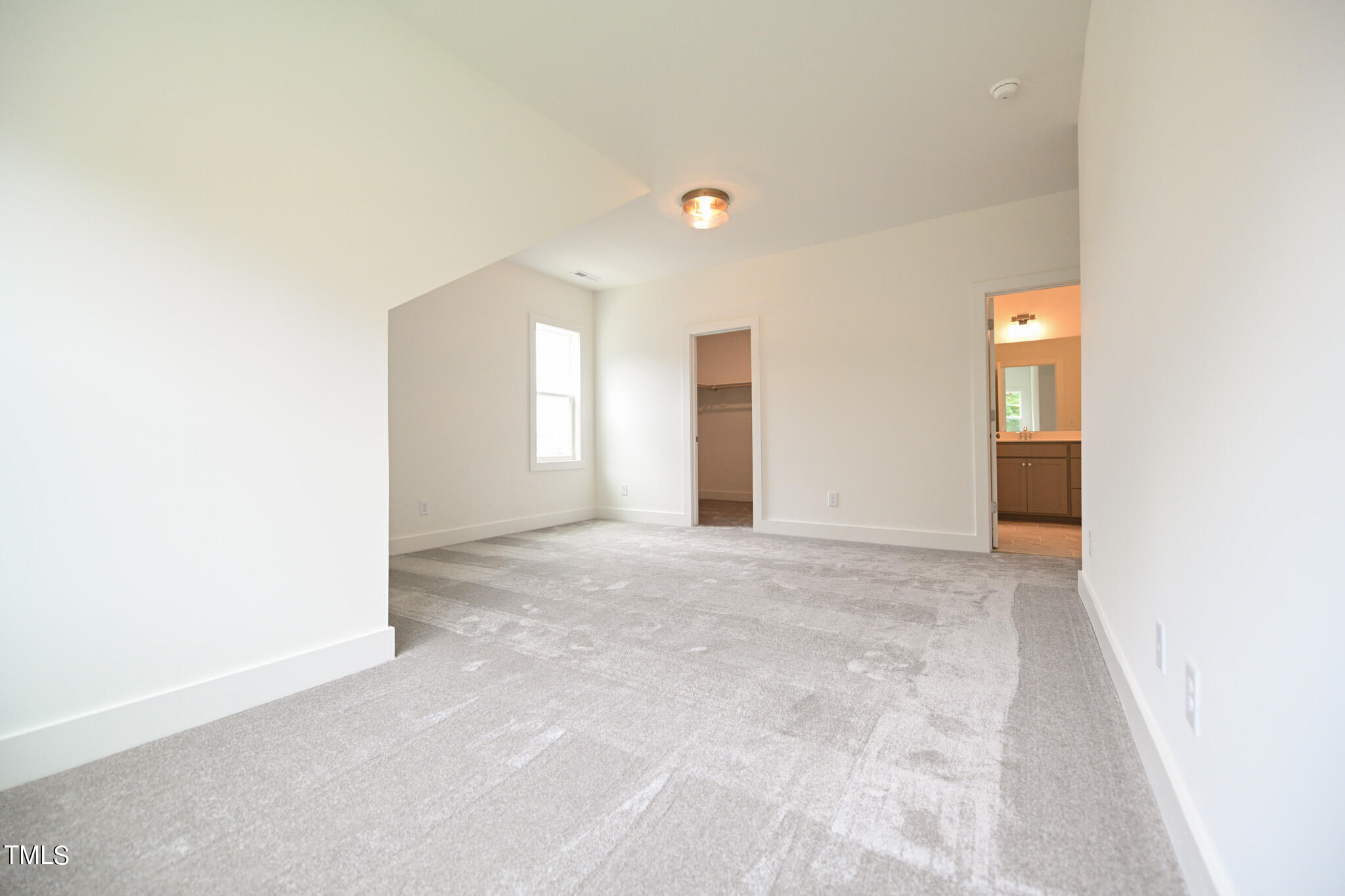 143 Sallyport Court Raleigh, NC 27603 - Photo 38 of 46 a view of an empty room with window and bathroom