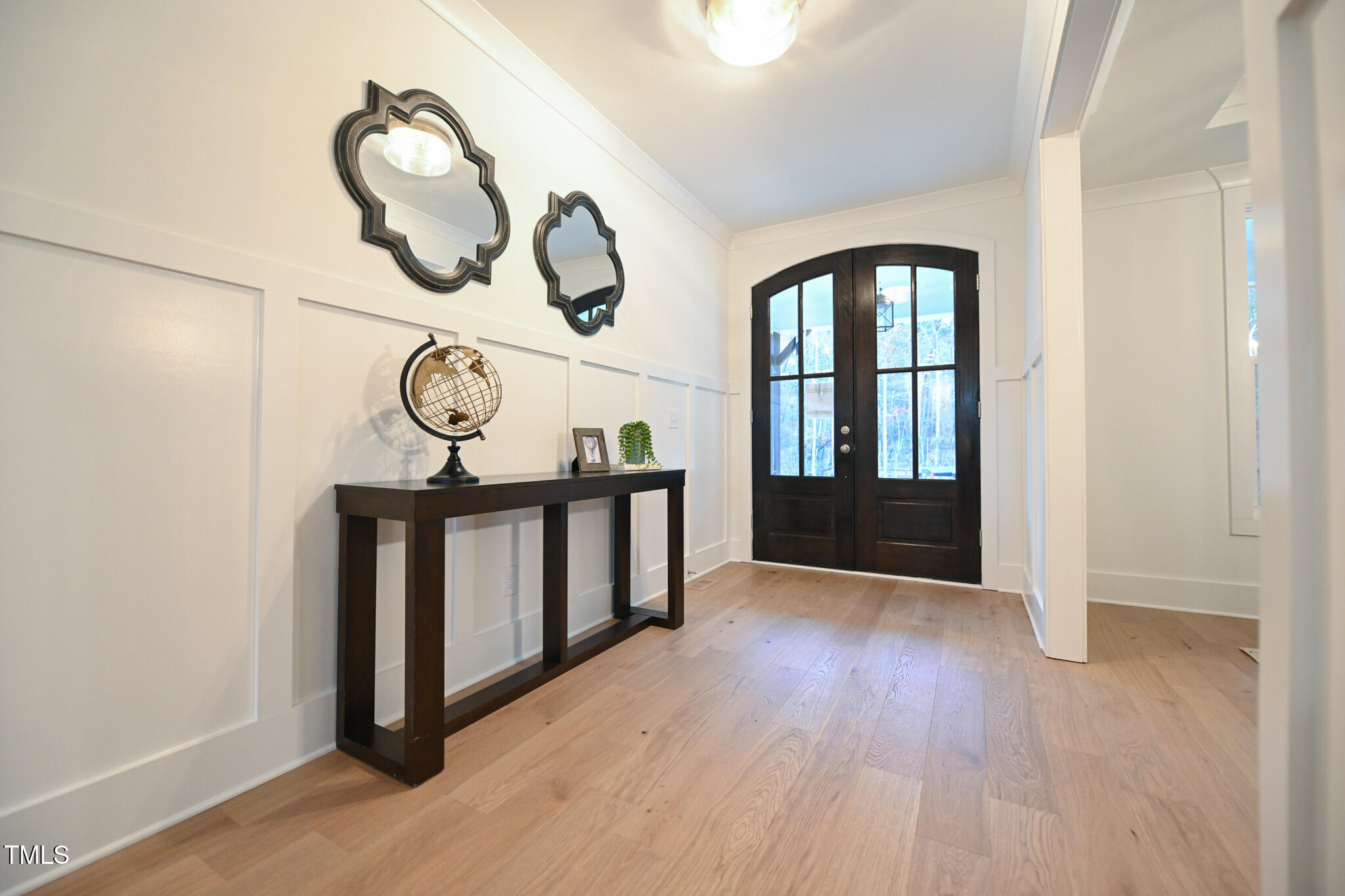 143 Sallyport Court Raleigh, NC 27603 - Photo 4 of 46 a view of entryway with wooden floor
