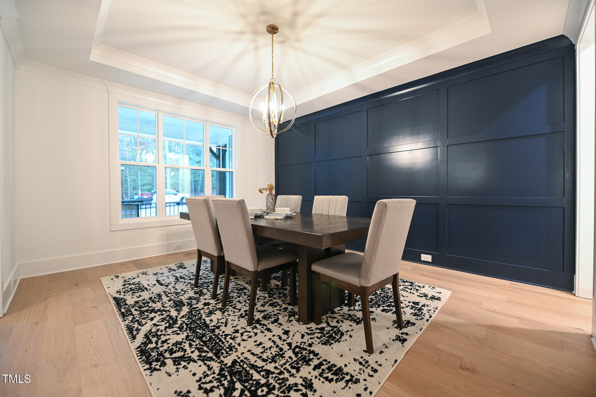 143 Sallyport Court Raleigh, NC 27603 - Photo 5 of 46 a view of a dining room with furniture wooden floor and chandelier