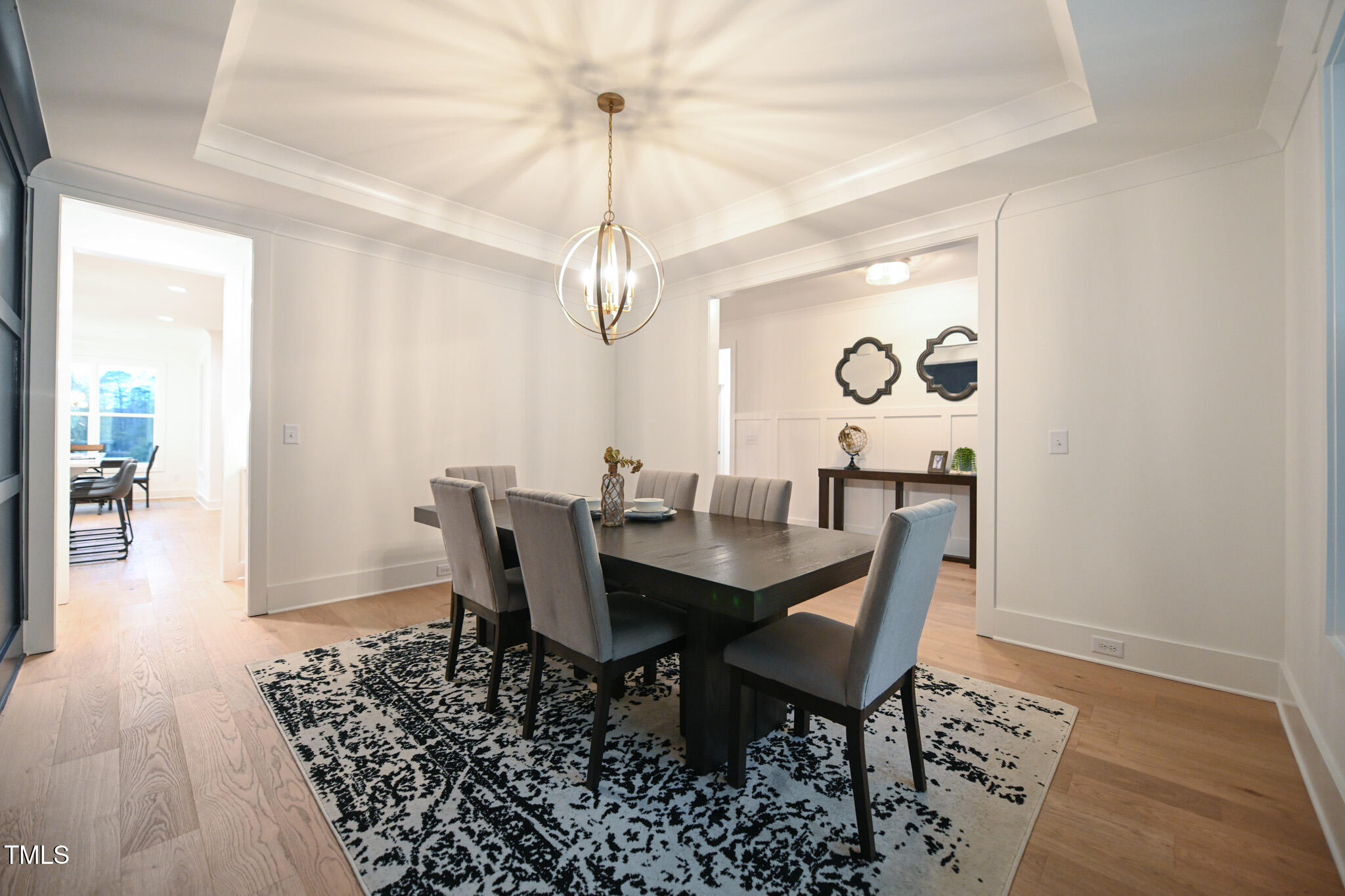 143 Sallyport Court Raleigh, NC 27603 - Photo 7 of 46 a view of a dining room with furniture and wooden floor
