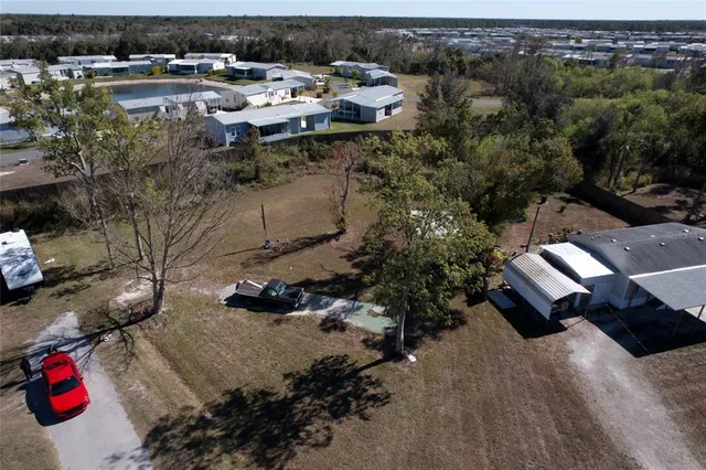 an aerial view of houses with yard