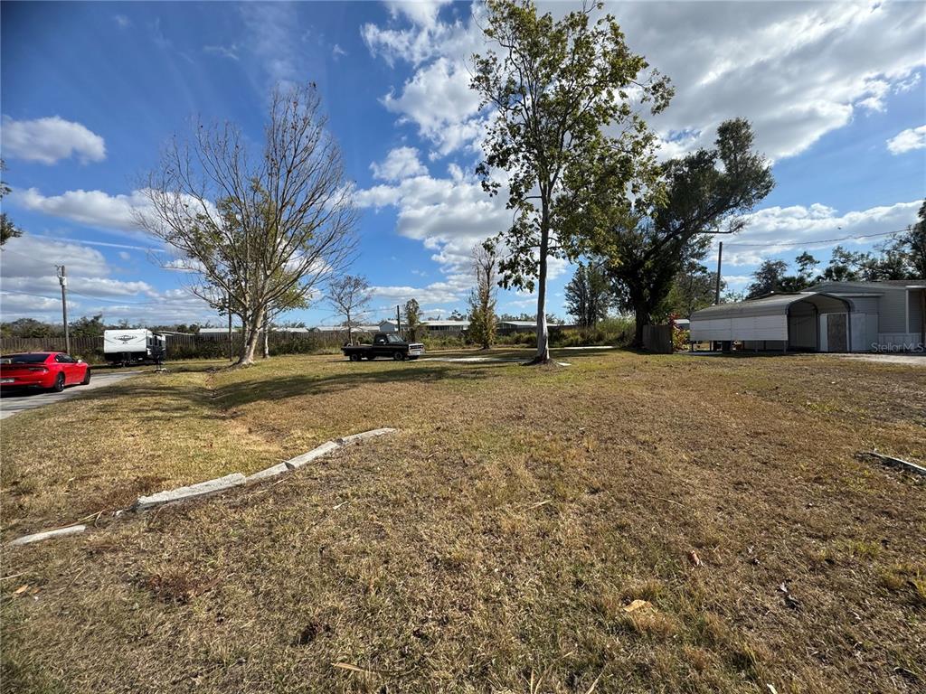 11854 Southwest Loop Terrace Arcadia, FL 34269 - Photo 4 of 7 a view of street with parked cars