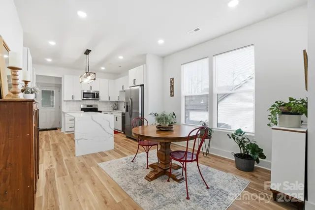 a kitchen with a table and chairs in it