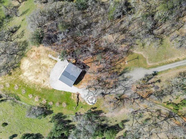 a aerial view of house with yard