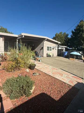 a view of a car park in front of a house