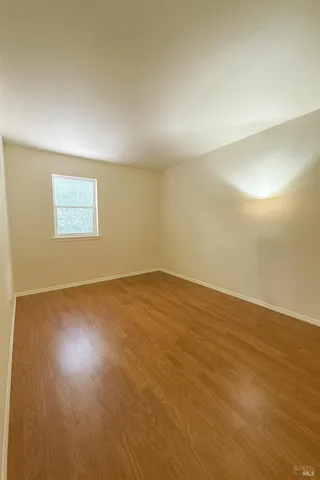 a bathroom with a toilet a sink and a mirror