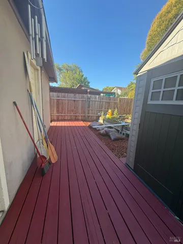 a view of a wooden deck with a bench
