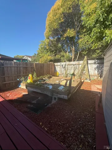 a view of a backyard of the house