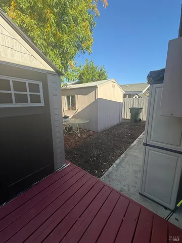 a view of a backyard of the house