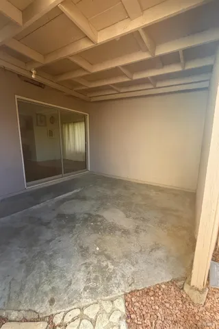 a view of balcony with furniture