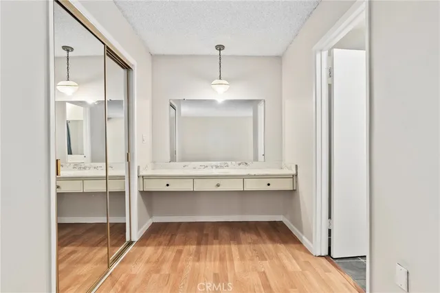a bathroom with a granite countertop sink mirror and double