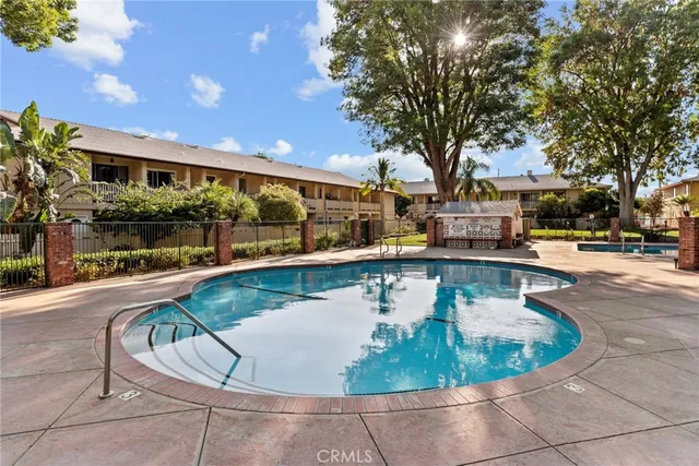 a view of a swimming pool with a patio