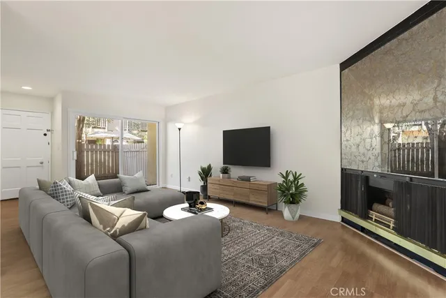 a view of an empty room with a fireplace