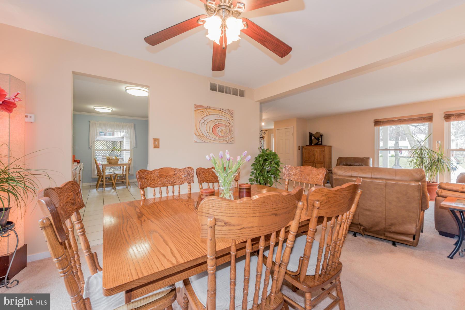 6166 Stevens Forest Road Columbia, MD 21045 - Photo 8 of 28 a view of a dining room with furniture window and outside view