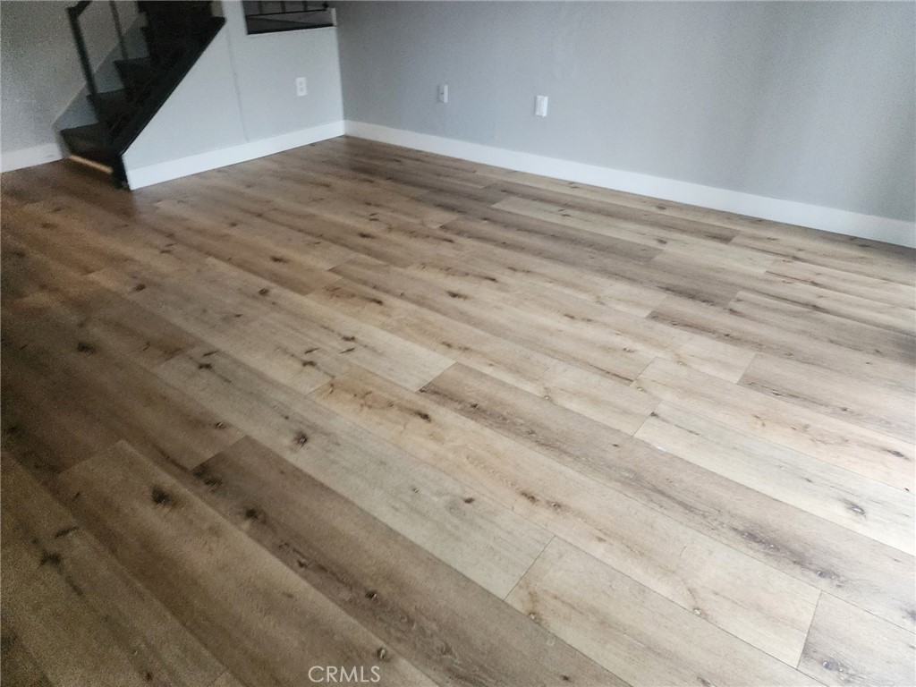 4877 Jackson Street, Unit C Riverside, CA 92503 - Photo 4 of 12 a view of empty room with wooden floor