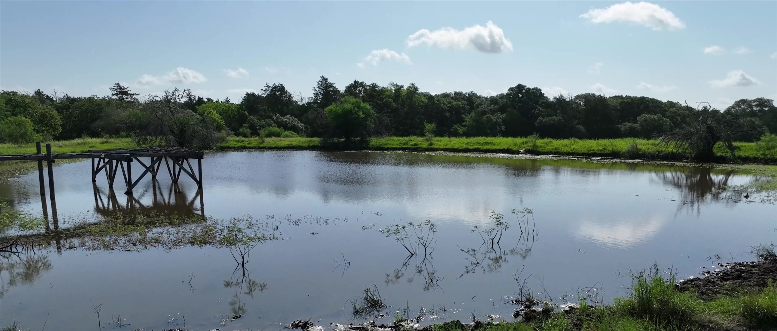 1649 County Road 209 Weimar, TX 78962 - Photo 4 of 27 a view of a lake with a mountain in the background