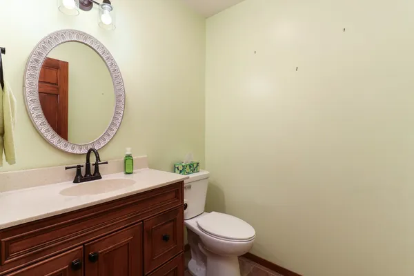 a bedroom with a bed dresser and a window