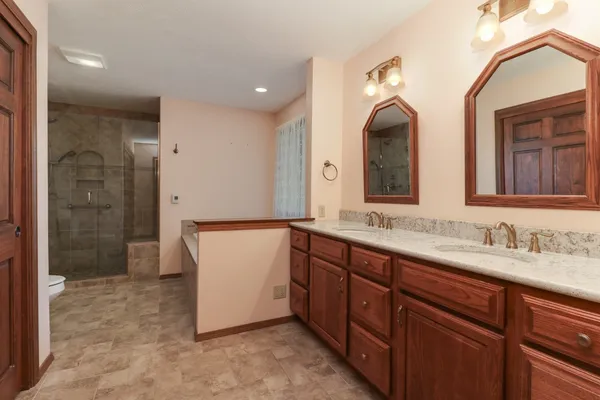 a bathroom with a bathtub and shower