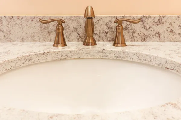 a view of a workspace with furniture and a book shelf