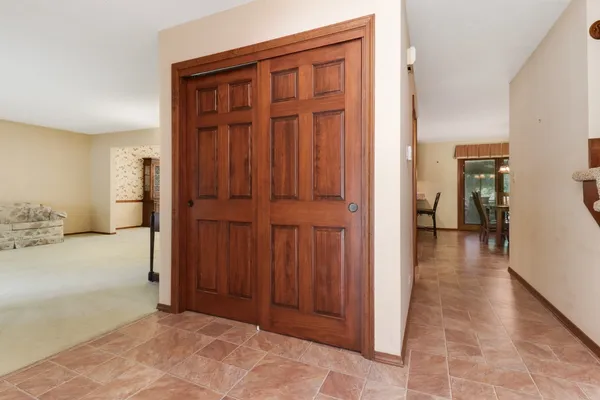 a view of a hallway with closet area