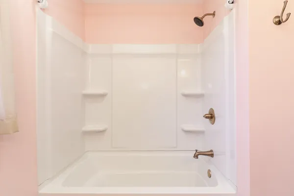 a bedroom with a bed and cabinets