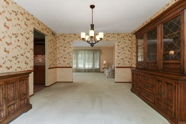 a view of a kitchen with a sink and cabinets