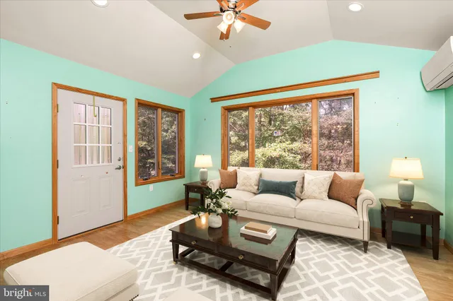 a living room with furniture and a large window