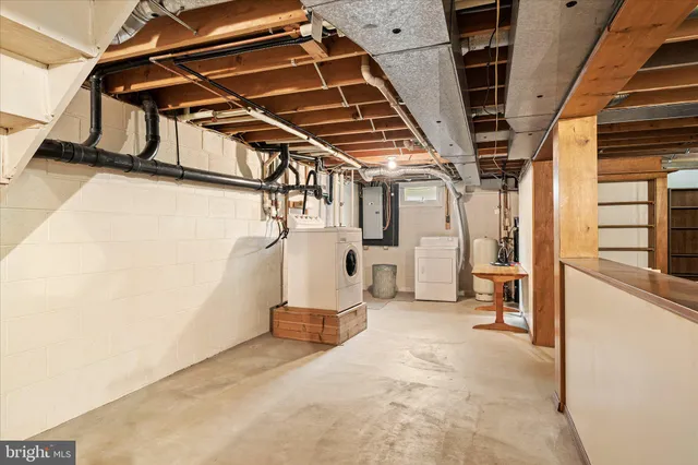 a view of an empty room with wooden walls