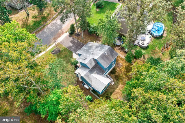 an aerial view of a house with outdoor space