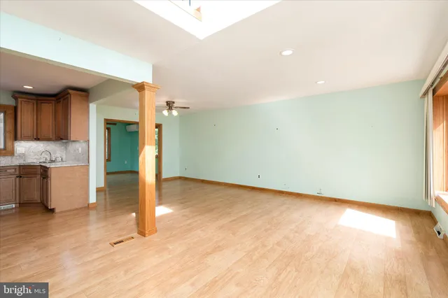 a view of a kitchen with a sink and cabinets
