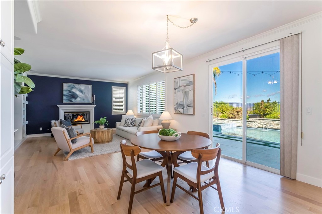 26413 Ocasey Place Stevenson Ranch, CA 91381 - Photo 17 of 75 a dining room with furniture a window and wooden floor