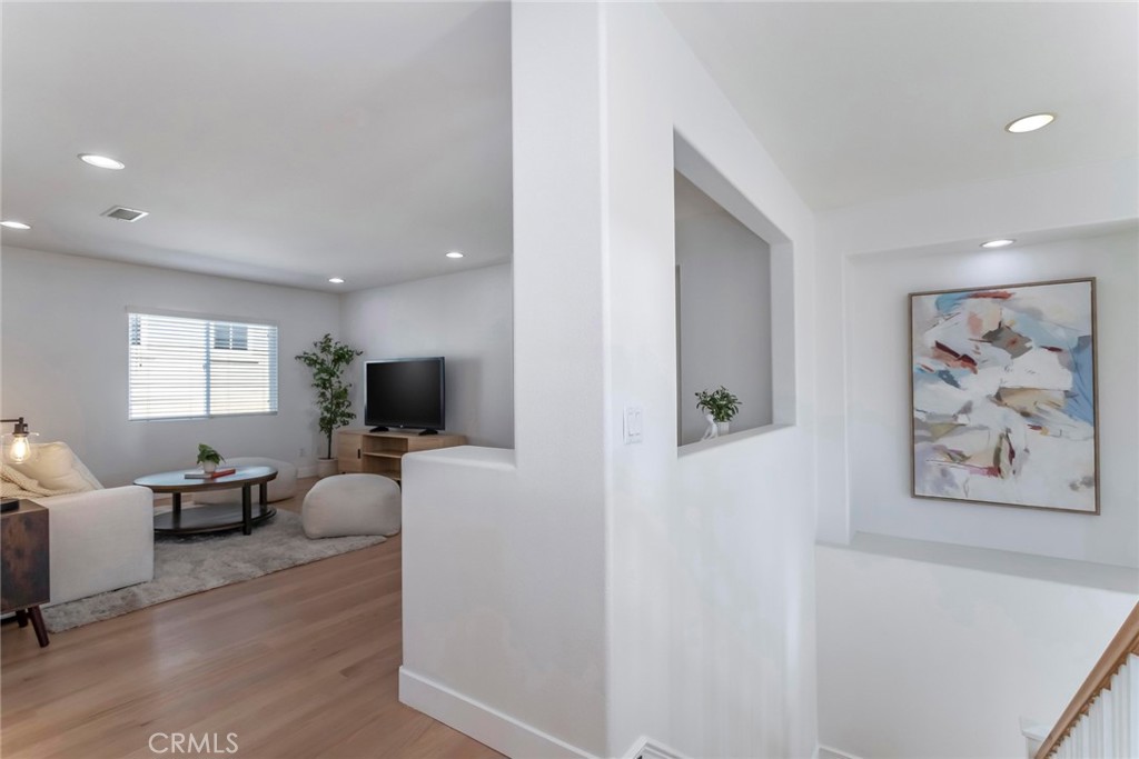 26413 Ocasey Place Stevenson Ranch, CA 91381 - Photo 30 of 75 a living room with furniture and a flat screen tv