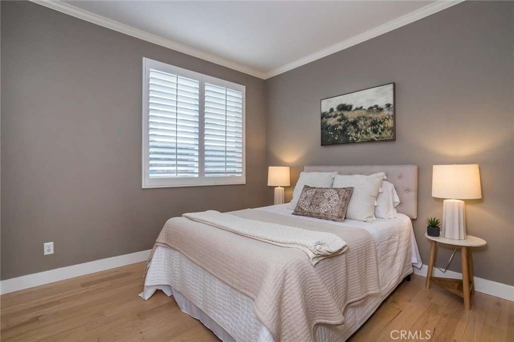 26413 Ocasey Place Stevenson Ranch, CA 91381 - Photo 50 of 75 a bedroom with a bed and a lamp
