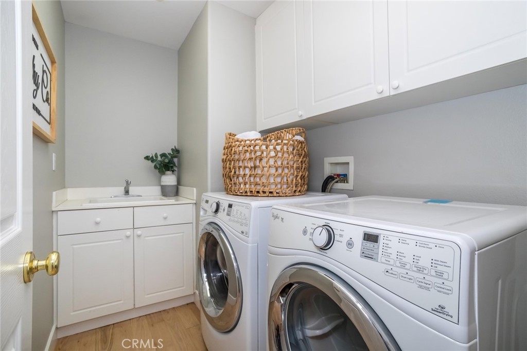 26413 Ocasey Place Stevenson Ranch, CA 91381 - Photo 52 of 75 a utility room with dryer and washer