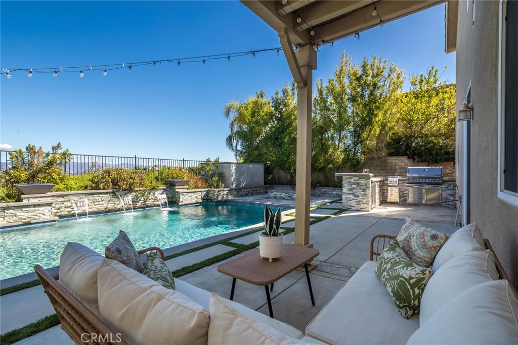 26413 Ocasey Place Stevenson Ranch, CA 91381 - Photo 53 of 75 a view of a chairs and table in the balcony