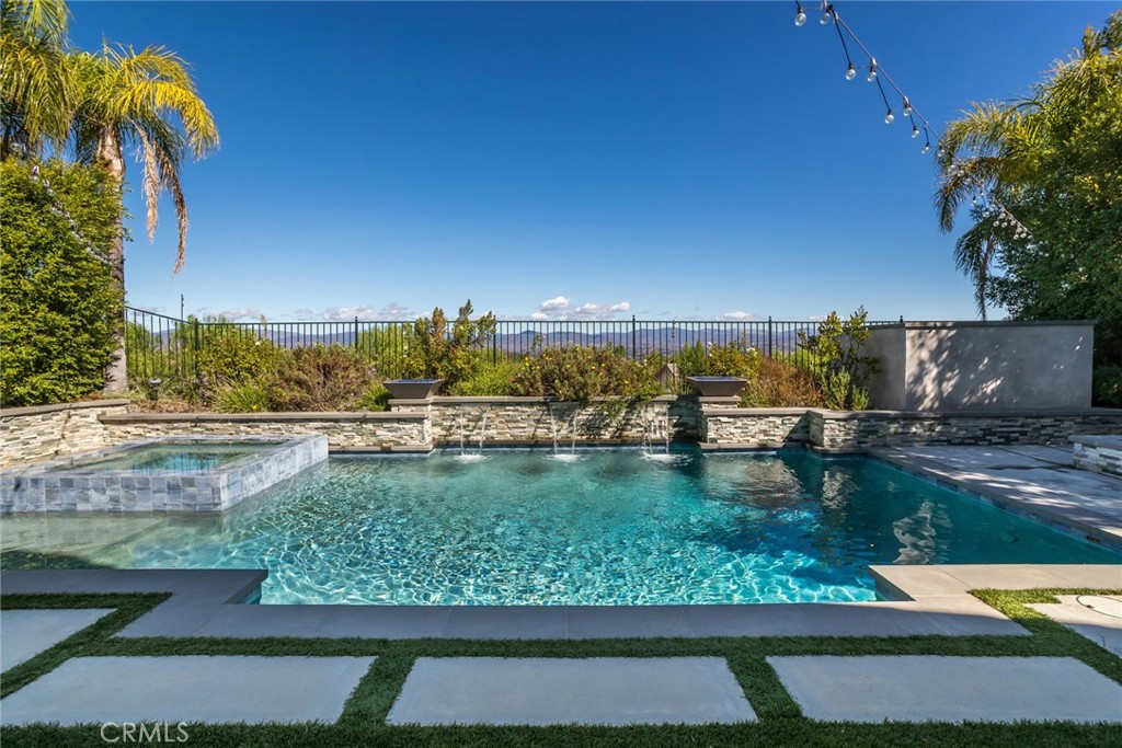 26413 Ocasey Place Stevenson Ranch, CA 91381 - Photo 56 of 75 a view of a lake from a yard