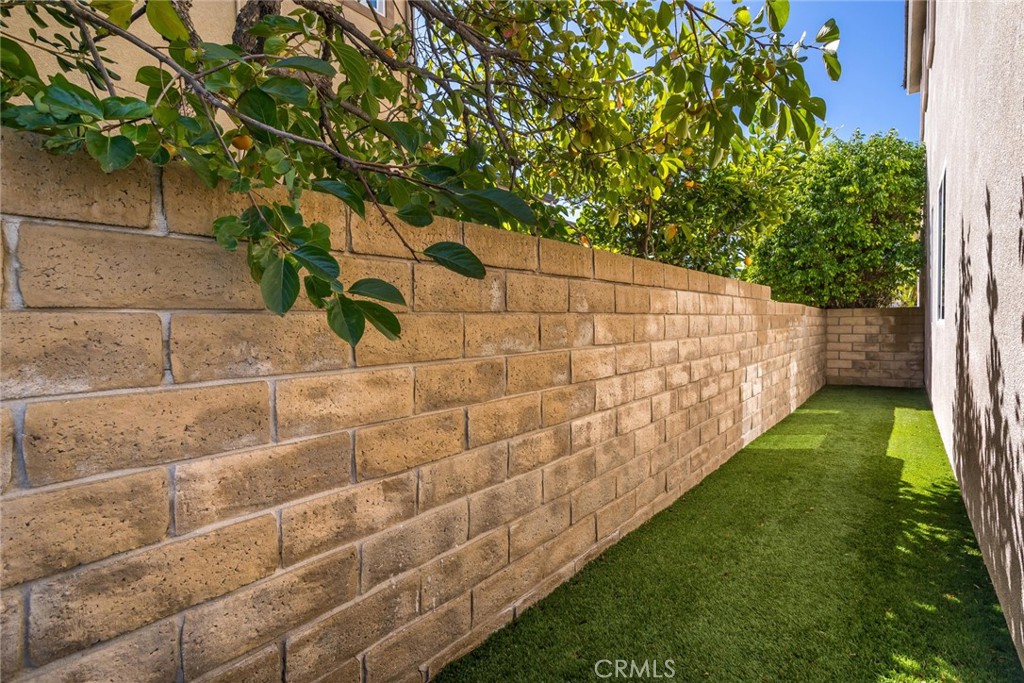 26413 Ocasey Place Stevenson Ranch, CA 91381 - Photo 59 of 75 a backyard of a house with lots of green space