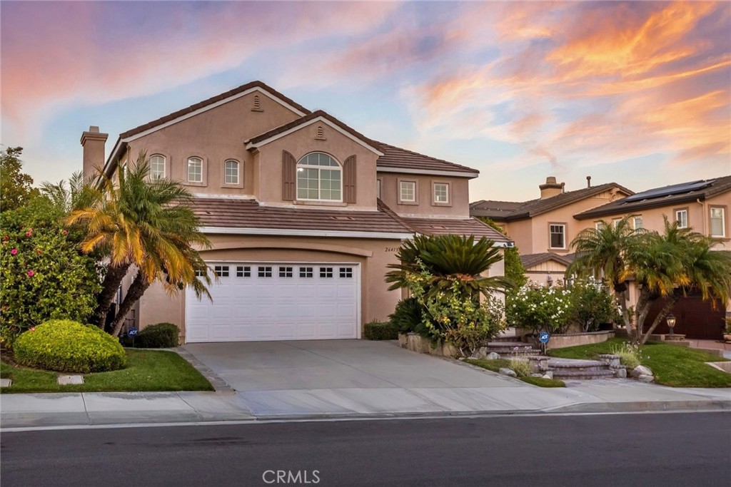 26413 Ocasey Place Stevenson Ranch, CA 91381 - Photo 63 of 75 a front view of a house with a yard and garage