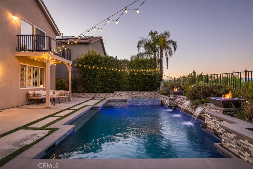 26413 Ocasey Place Stevenson Ranch, CA 91381 - Photo 65 of 75 a view of a house with backyard and sitting area