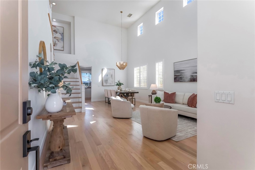 26413 Ocasey Place Stevenson Ranch, CA 91381 - Photo 8 of 75 a living room with furniture and a potted plant