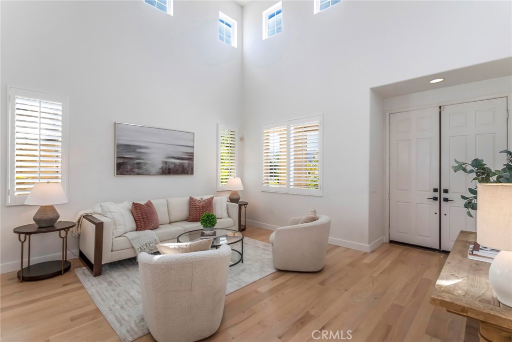 26413 Ocasey Place Stevenson Ranch, CA 91381 - Photo 10 of 75 a living room with furniture and wooden floor