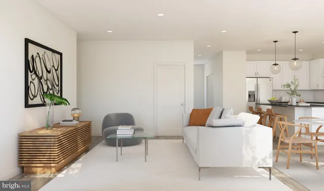 a living room with furniture and a lamp