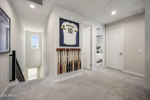 a view of a hallway with entryway door