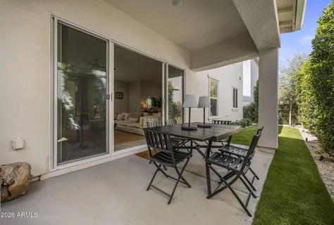 a view of an outdoor dining space with a patio