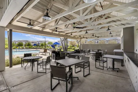 a view of a big room with lots of tables and chairs