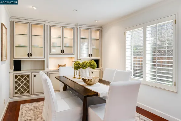 a dining room with furniture and window