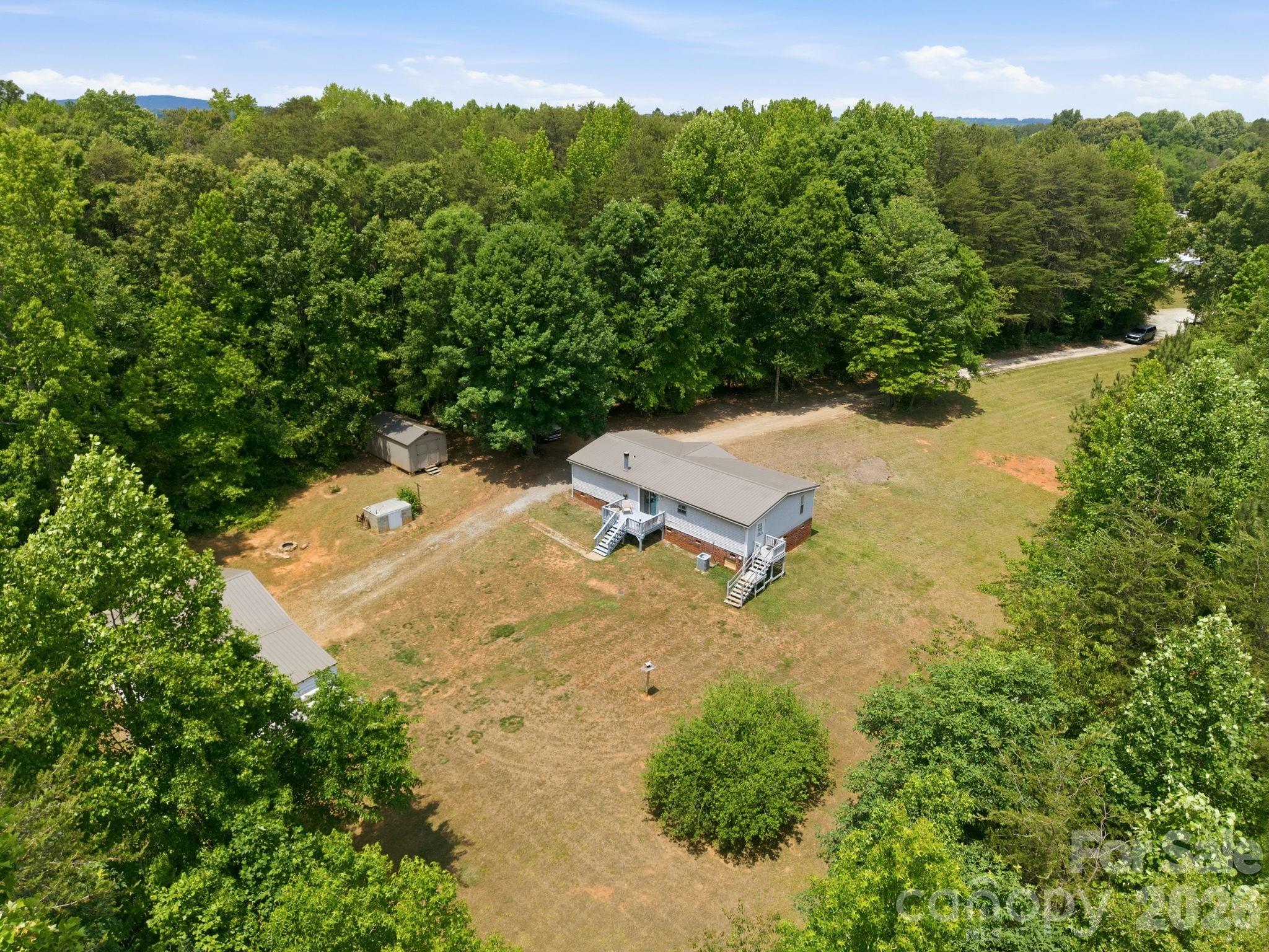 675 Overcash Road Salisbury, NC 28147 - Photo 42 of 48 an aerial view of a house with a yard and lake view