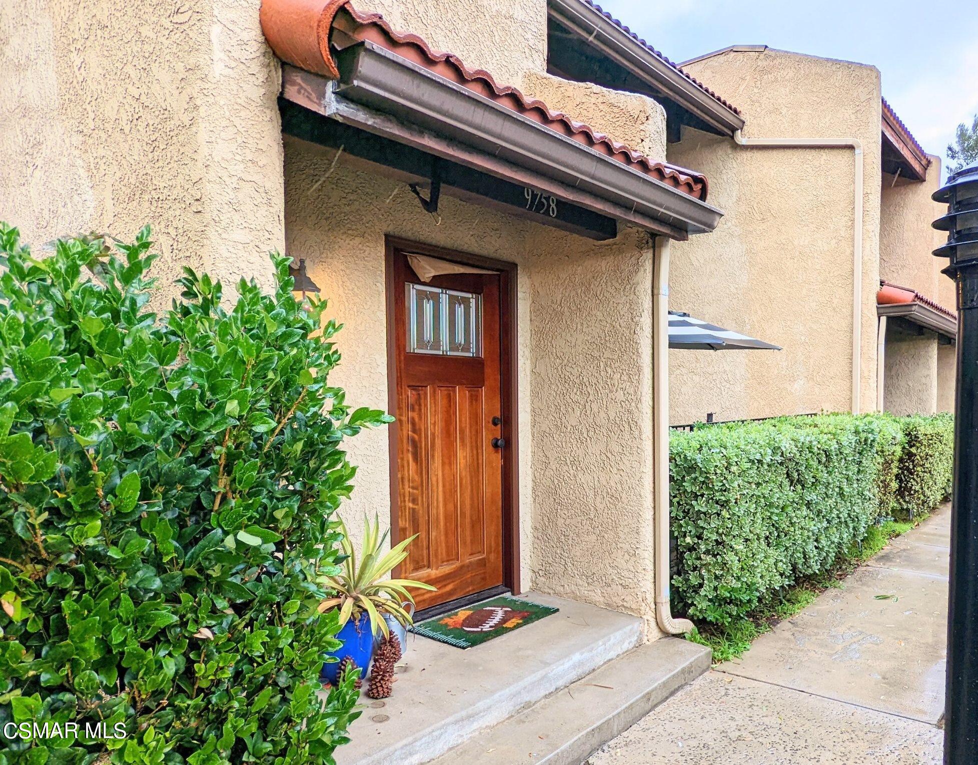 9758 Vía Roma Burbank, CA 91504 - Photo 2 of 8 a front view of a house with a yard