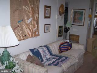 0 Edward Taylor Road, Unit 6 Ocean City, MD 21842 - Photo 2 of 6 a bedroom with bed and a painting on the wall